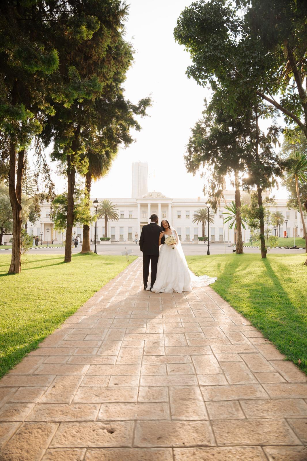 Couple on a garden path at golden hour